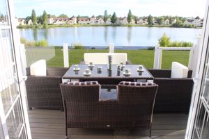 Deck view - table and chairs- click for photo gallery